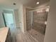 Bathroom with a tiled shower and a view of the hallway with walk-in closet at 3904 Allegretto Cir # 50, Atlanta, GA 30339