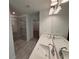 Modern bathroom features double sinks, a glass-enclosed shower, and a walk-in closet at 3904 Allegretto Cir # 50, Atlanta, GA 30339