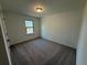 Bedroom with neutral walls and soft gray carpet at 3904 Allegretto Cir # 50, Atlanta, GA 30339