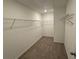 A spacious walk-in closet with wire shelving and neutral carpeting at 3904 Allegretto Cir # 50, Atlanta, GA 30339