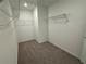 A spacious walk-in closet with wire shelving and neutral carpeting at 3904 Allegretto Cir # 50, Atlanta, GA 30339