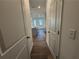 Hallway with wood floors leading into the kitchen at 3904 Allegretto Cir # 50, Atlanta, GA 30339