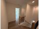 Hallway landing featuring wood floors and wooden railings with natural lighting at 3904 Allegretto Cir # 50, Atlanta, GA 30339