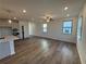 Bright and open living space featuring wood floors, recessed lighting, and a kitchen with an island at 3904 Allegretto Cir # 50, Atlanta, GA 30339