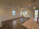 Sunlit living room features hardwood floors, modern ceiling fan, and an inviting atmosphere at 3904 Allegretto Cir # 50, Atlanta, GA 30339