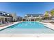 Resort-style pool with lounge chairs and covered cabanas, set against townhome backdrop at 3904 Allegretto Cir # 50, Atlanta, GA 30339