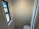 Powder room with window. Neutral color palette at 3904 Allegretto Cir # 50, Atlanta, GA 30339