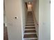 Stairway with wood treads and white risers, featuring a light wood handrail at 3904 Allegretto Cir # 50, Atlanta, GA 30339