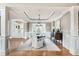 Elegant dining room featuring hardwood floors, wainscoting, and open access to the front door at 3963 Hazelhurst Lake Dr, Marietta, GA 30066