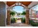 Covered porch with stone columns offering a scenic neighborhood view at 3963 Hazelhurst Lake Dr, Marietta, GA 30066