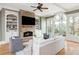 Inviting living room with stone fireplace, built-in shelving, and natural light at 3963 Hazelhurst Lake Dr, Marietta, GA 30066