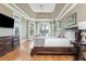 Cozy main bedroom with bay window, tray ceiling, and hardwood floors at 3963 Hazelhurst Lake Dr, Marietta, GA 30066