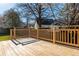 Spacious wooden back deck with railing overlooking yard and trees at 4162 Lake Mist Nw Dr, Kennesaw, GA 30144