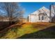 Enjoy the serene backyard with lush lawn and a wooden deck, perfect for outdoor relaxation at 4162 Lake Mist Nw Dr, Kennesaw, GA 30144