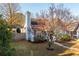 Charming home with a view of the side yard and mature trees at 4162 Lake Mist Nw Dr, Kennesaw, GA 30144