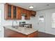 Cozy kitchen with granite countertops, stainless steel appliances, and wood cabinetry at 4162 Lake Mist Nw Dr, Kennesaw, GA 30144