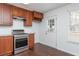 Cozy kitchen with granite countertops, stainless steel appliances, and wood cabinetry at 4162 Lake Mist Nw Dr, Kennesaw, GA 30144