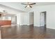 Open-concept room with beautiful hardwood flooring, white walls, and neutral color palette at 4162 Lake Mist Nw Dr, Kennesaw, GA 30144