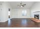 Spacious living room with fireplace, ceiling fan, hardwood floors, and natural light at 4162 Lake Mist Nw Dr, Kennesaw, GA 30144