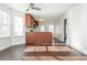 Bright living room featuring hardwood floors, a ceiling fan, and large windows for natural light at 4162 Lake Mist Nw Dr, Kennesaw, GA 30144