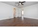 Spacious main bedroom featuring hardwood floors, a ceiling fan, and ample closet space at 4162 Lake Mist Nw Dr, Kennesaw, GA 30144