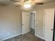 Bedroom features include carpet flooring, a ceiling fan, and open doorway to other rooms at 4421 Fulson Dr, Lilburn, GA 30047