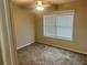 Bedroom features include carpet flooring, a ceiling fan, and a window with natural light at 4421 Fulson Dr, Lilburn, GA 30047