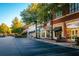 Street view of vibrant commercial area with well-maintained landscaping, benches, and variety of retail shops at 5005 Crestline View Rd, Cumming, GA 30028