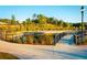 A tranquil pond in the community with walking path, lush landscaping, and trees provides a serene and inviting outdoor space at 5005 Crestline View Rd, Cumming, GA 30028