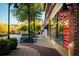 Picturesque street view of retail storefronts with beautiful landscaping and pedestrian walkways at 5005 Crestline View Rd, Cumming, GA 30028