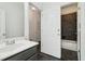 Bathroom featuring neutral paint, single sink, and walk in shower at 556 Moreland Ne Ave # J, Atlanta, GA 30307