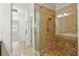 Bathroom with walk-in shower, glass door, and tiled shower at 556 Moreland Ne Ave # J, Atlanta, GA 30307