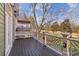 Outdoor deck area with decorative railing and view of the trees at 556 Moreland Ne Ave # J, Atlanta, GA 30307