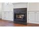 Inviting fireplace with tiled surround and built-in cabinets on either side at 556 Moreland Ne Ave # J, Atlanta, GA 30307