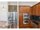 Kitchen features stainless steel appliances, custom cabinets, and granite countertops at 556 Moreland Ne Ave # J, Atlanta, GA 30307