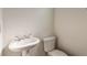 Powder room featuring commode and pedestal sink at 556 Moreland Ne Ave # J, Atlanta, GA 30307