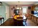 Inviting dining room featuring a wooden table with seating for eight and stylish pendant lighting at 1536 Hunters Cv, Auburn, GA 30011