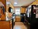 Kitchen featuring black appliances and wood cabinets at 1536 Hunters Cv, Auburn, GA 30011