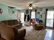 Inviting living room offering comfortable seating, views to front yard, and stairs to upper level at 1536 Hunters Cv, Auburn, GA 30011