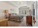 Spacious main bedroom with tray ceiling, large window, and neutral decor at 553 Oakside Pl, Acworth, GA 30102