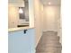 Hallway area boasts hardwood flooring and access to kitchen with granite countertops at 680 Sundial Ln, Mableton, GA 30126