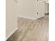 Bright hallway features hardwood flooring, fresh paint, and white trim at 680 Sundial Ln, Mableton, GA 30126