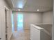 Bright hallway with carpet features access to multiple rooms and stairway at 680 Sundial Ln, Mableton, GA 30126