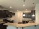 Spacious kitchen features granite countertops, stainless steel appliances, and ample cabinet space at 680 Sundial Ln, Mableton, GA 30126