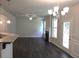 Open living room with hardwood floors, fireplace, ceiling fan and lots of natural light at 680 Sundial Ln, Mableton, GA 30126