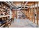 Unfinished basement showing exposed ceiling with wooden beams and visible ductwork, ready for customization at 811 Weeping Willow Dr, Powder Springs, GA 30127