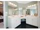 Bright bathroom features a double vanity with ample counter space and a separate makeup area at 811 Weeping Willow Dr, Powder Springs, GA 30127