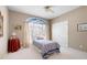 Cozy bedroom features a comfortable bed and a large window, providing ample natural light at 811 Weeping Willow Dr, Powder Springs, GA 30127