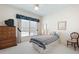 Bedroom featuring natural light, a patterned bedspread and a large wooden dresser at 811 Weeping Willow Dr, Powder Springs, GA 30127