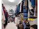 Walk-in closet with custom shelving and ample storage space for clothes, shoes, and accessories at 811 Weeping Willow Dr, Powder Springs, GA 30127